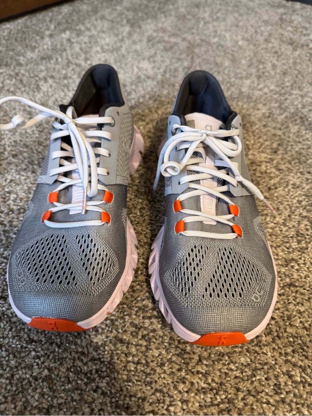 On Running Gray and Pink Running Shoe with Orange Insole Accent